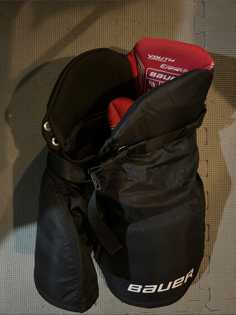 Bauer Youth Hockey Pants in Black with Red Liner